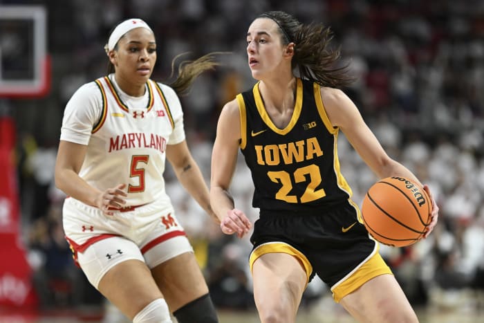 Iowa Hawkeyes guard Caitlin Clark (22) looks to pass as Maryland Terrapins guard Brinae Alexander (5) defends during the fist half at Xfinity Center.